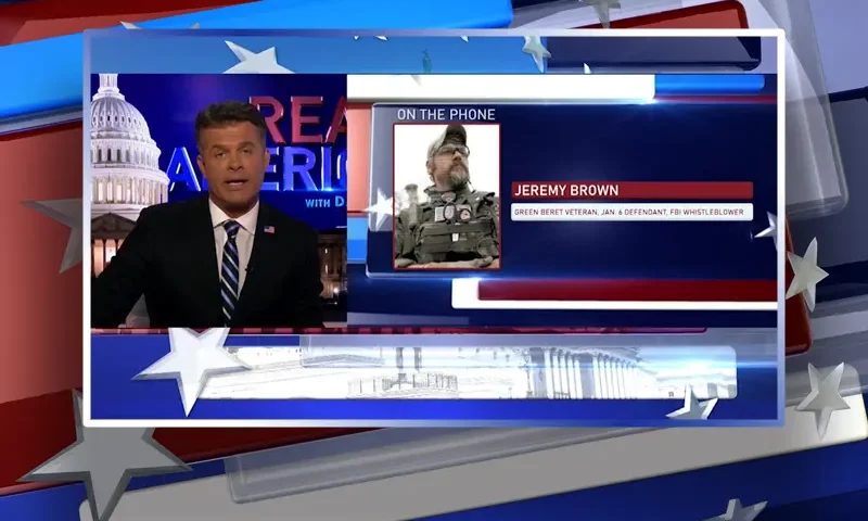 Video still from Real America on One America News Network during an interview with the guest, Jeremy Brown.