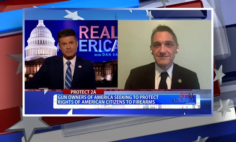 Video still from Real America on One America News Network showing a split screen of the host on the left side, and on the right side is the guest, Stephen Stamboulieh.