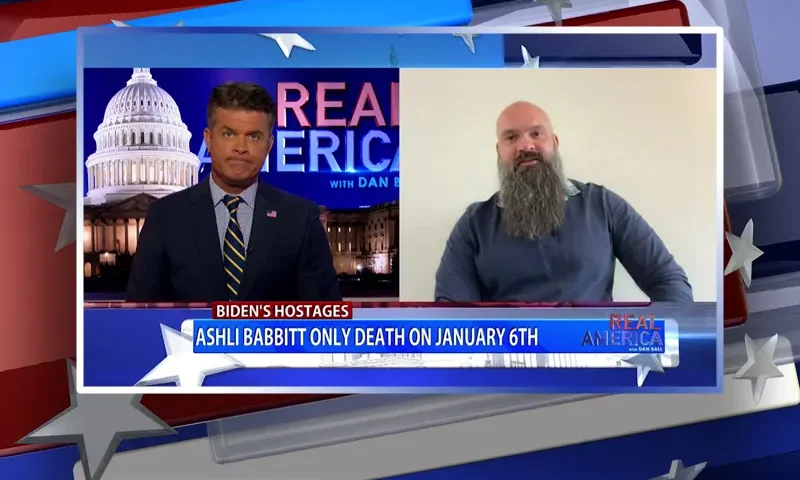 Video still from Real America on One America News Network showing a split screen of the host on the left side, and on the right side is the guest, Aaron Babbitt.