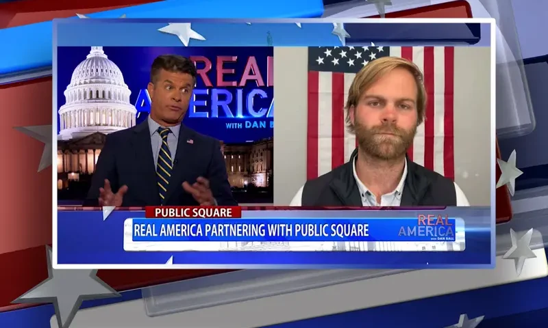 Video still from Real America on One America News Network showing a split screen of the host on the left side, and on the right side is the guest, Michael Seifert.