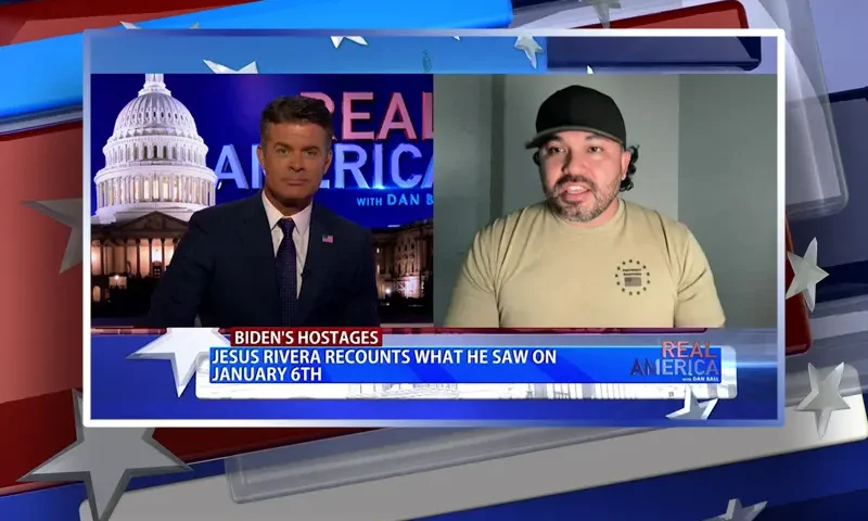 Video still from Real America on One America News Network showing a split screen of the host on the left side, and on the right side is the guest, Jesus Rivera.