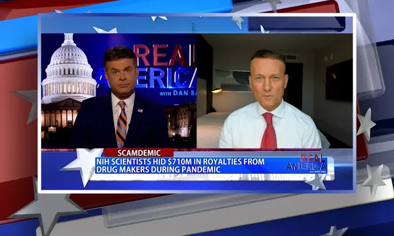 Video still from Real America on One America News Network showing a split screen of the host on the left side, and on the right side is the guest, Adam Andrzejewski.