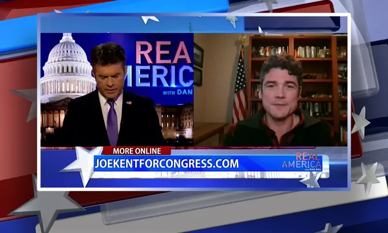 Video still from Real America on One America News Network showing a split screen of the host on the left side, and on the right side is the guest, Joe Kent.