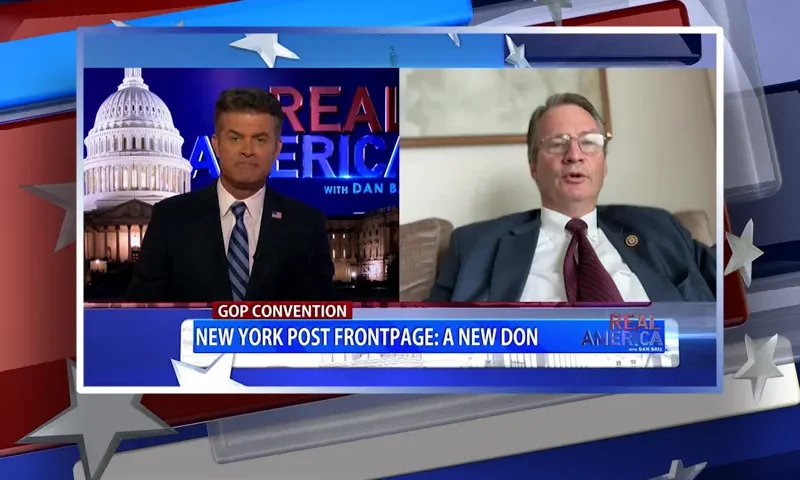 Video still from Real America on One America News Network showing a split screen of the host on the left side, and on the right side is the guest, Rep. Tim Burchett.