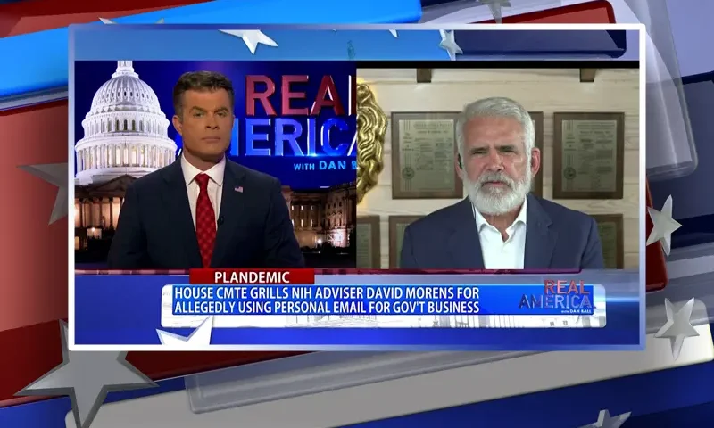 Video still from Real America on One America News Network showing a split screen of the host on the left side, and on the right side is the guest, Dr. Robert Malone.