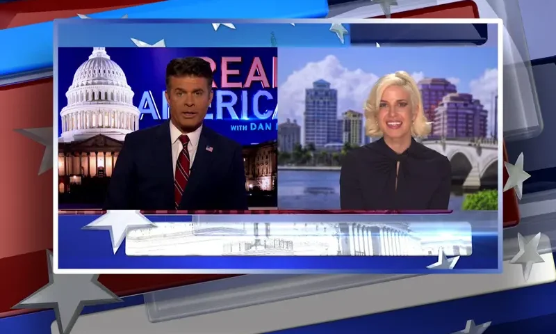 Video still from Real America on One America News Network showing a split screen of the host on the left side, and on the right side is the guest, Caroline Sunshine.