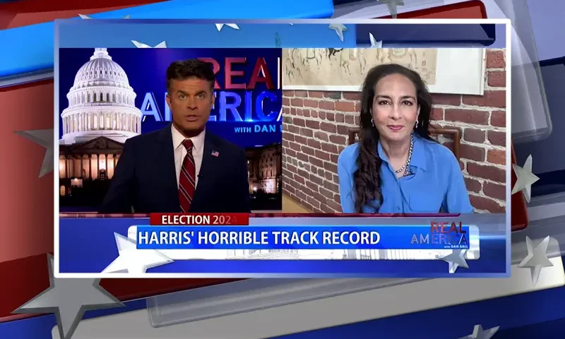 Video still from Real America on One America News Network showing a split screen of the host on the left side, and on the right side is the guest, Harmeet Dhillon.