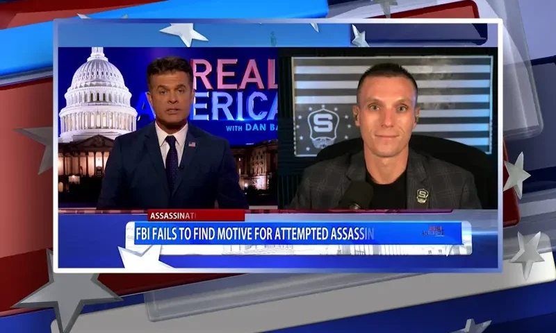 Video still from Real America on One America News Network showing a split screen of the host on the left side, and on the right side is the guest, Steve Friend.