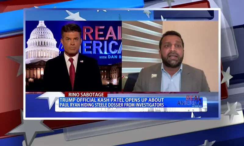 Video still from Real America on One America News Network showing a split screen of the host on the left side, and on the right side is the guest, Kash Patel.