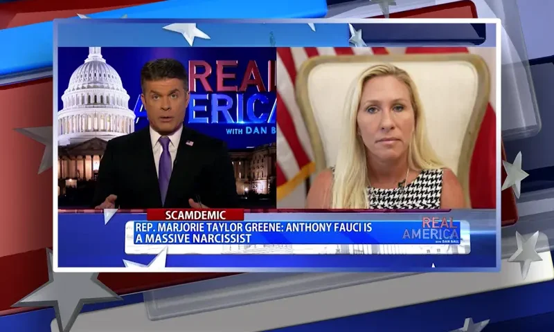 Video still from Real America on One America News Network showing a split screen of the host on the left side, and on the right side is the guest, Rep. Marjorie Taylor Greene.