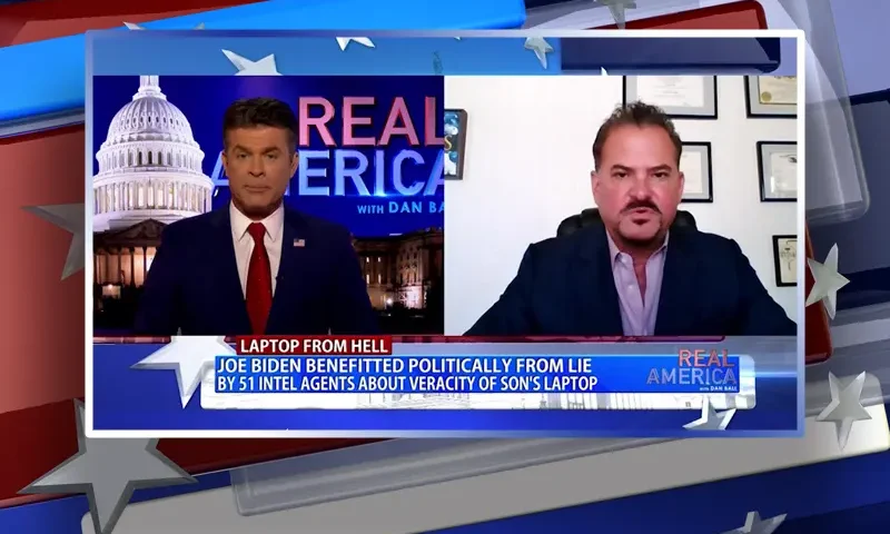 Video still from Real America on One America News Network showing a split screen of the host on the left side, and on the right side is the guest, David Wohl.