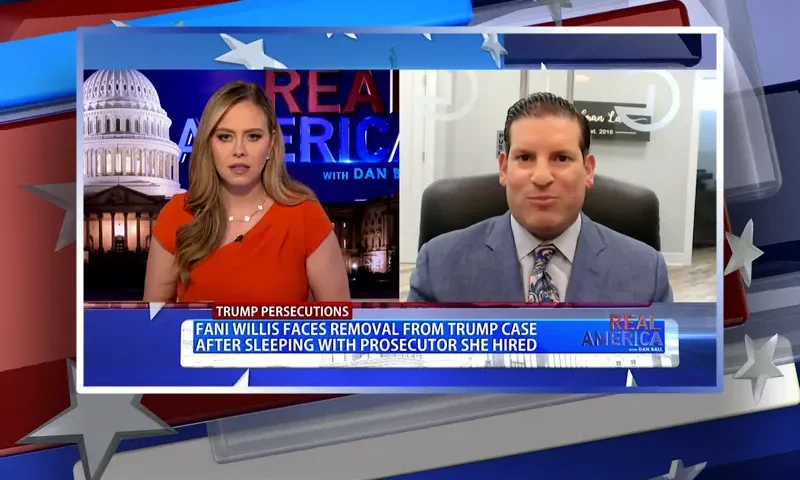 Video still from Real America on One America News Network showing a split screen of the host on the left side, and on the right side is the guest, Anna Steinberg.