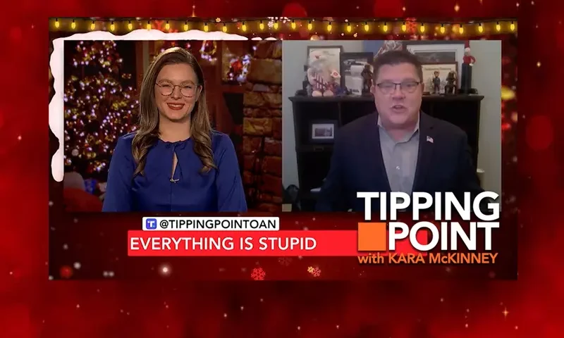 Video still from Tipping Point on One America News Network showing a split screen of the host on the left side, and on the right side is the guest, Jim Nelles.