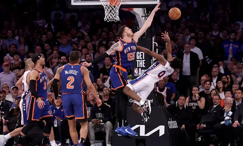 New York Knicks center Isaiah Hartenstein (55) defends a shot by Philadelphia 76ers guard Tyrese Maxey (0) during overtime in game 5 of the first round of the 2024 NBA playoffs at Madison Square Garden. Mandatory Credit: Brad Penner-USA TODAY Sports