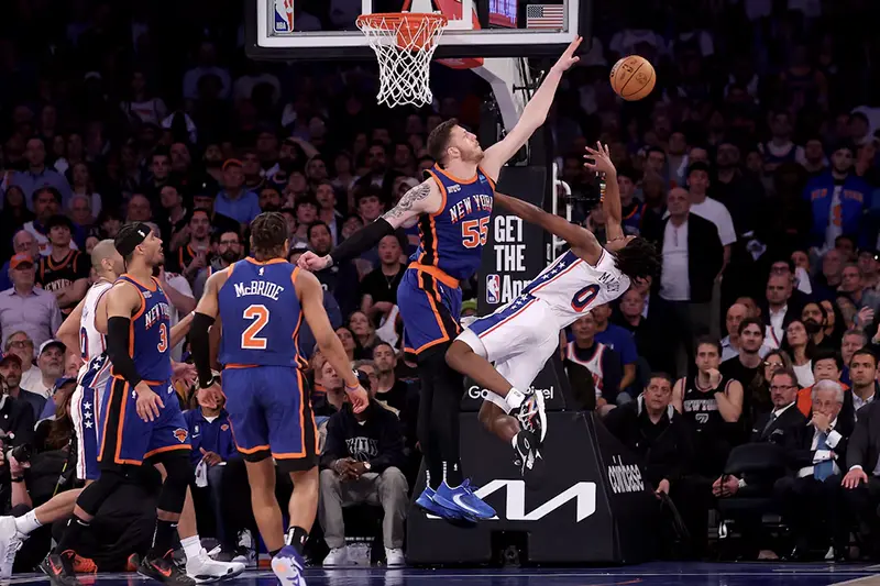 New York Knicks center Isaiah Hartenstein (55) defends a shot by Philadelphia 76ers guard Tyrese Maxey (0) during overtime in game 5 of the first round of the 2024 NBA playoffs at Madison Square Garden. Mandatory Credit: Brad Penner-USA TODAY Sports